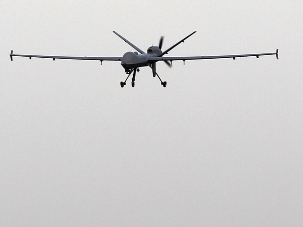 A Predator B unmanned aircraft returns to the Naval Air Station in Corpus Christi, Texas. U.S. Customs and Border Protection is expanding its use of drones to patrol U.S. borders.