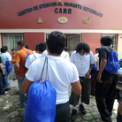 Honduran migrants deported from the United States wait to complete their paperwork as they return to their home country in August.