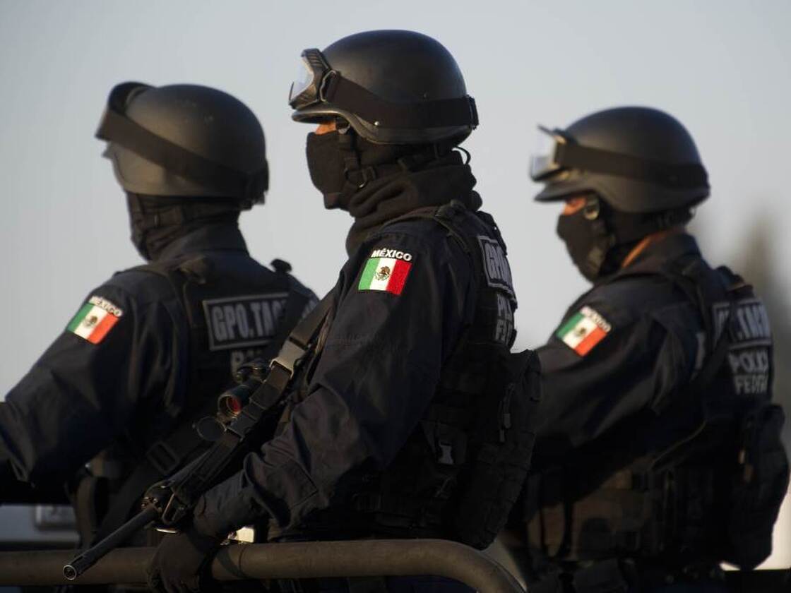 Federal policemen escort the armored car carrying a member of Los Zetas drug cartel in June. The security forces have been accused of abuses in the fight against the drug cartels.