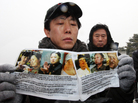 Park Sang-nak, a North Korean defector, displays anti-North Korea leaflets before sending them by balloon into North Korea, at Imjinggak peace park in South Korea near the Demilitarized Zone dividing the two Koreas on Wednesday. Defectors from the North are hoping the death of North Korean leader Kim Jong Il may provide an opportunity for political change. Park Sang-nak, a North Korean defector, displays anti-North Korea leaflets before sending them by balloon into North Korea, at Imjinggak peace park in South Korea near the Demilitarized Zone dividing the two Koreas on Wednesday. Defectors from the North are hoping the death of North Korean leader Kim Jong Il may provide an opportunity for political change.