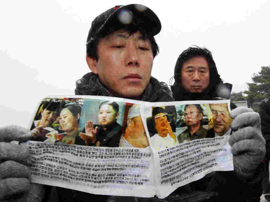 Park Sang-nak, a North Korean defector, displays anti-North Korea leaflets before sending them by balloon into North Korea, at Imjinggak peace park in South Korea near the Demilitarized Zone dividing the two Koreas on Wednesday. Defectors from the North are hoping the death of North Korean leader Kim Jong Il may provide an opportunity for political change.