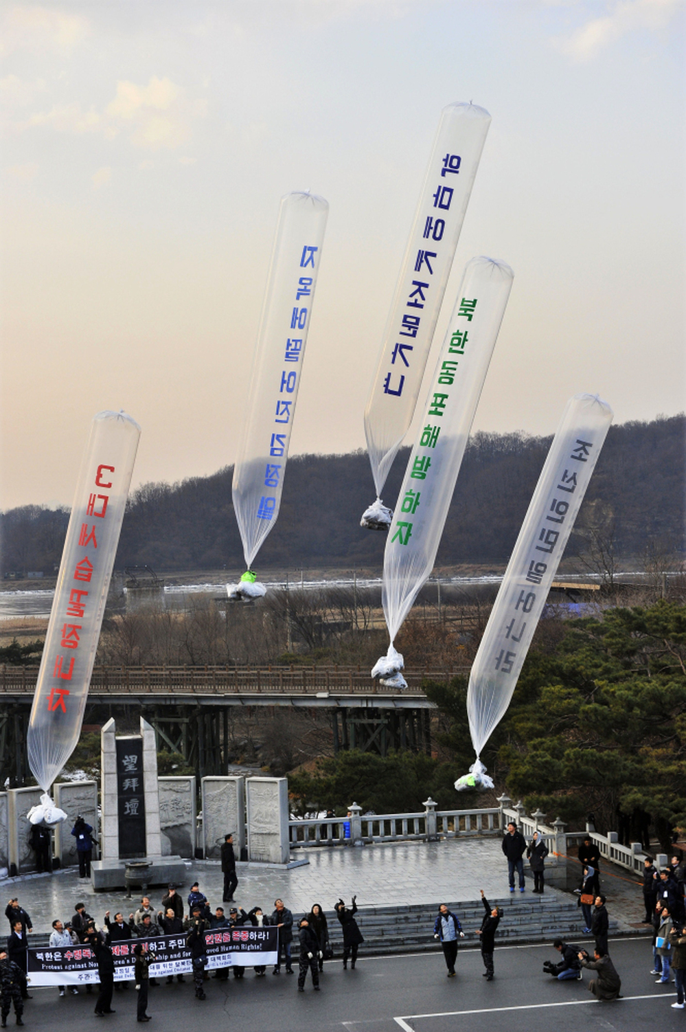 Anti-North Korea protesters release balloons containing leaflets denouncing Kim Jong-Il at Imjinggak peace park in South Korea near the DMZ on Wednesday, Dec. 21.