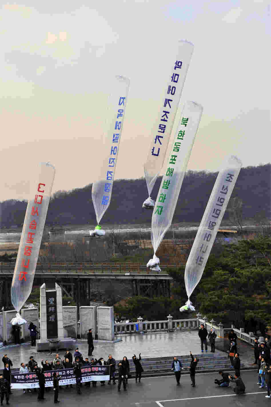 Anti-North Korea protesters release balloons containing leaflets denouncing Kim Jong-Il at Imjinggak peace park in South Korea near the DMZ on Wednesday, Dec. 21.