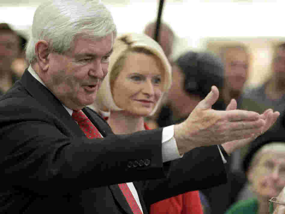 Republican presidential hopeful Newt Gingrich, with his wife, Callista, by his side, campaigns in Iowa on Tuesday. 