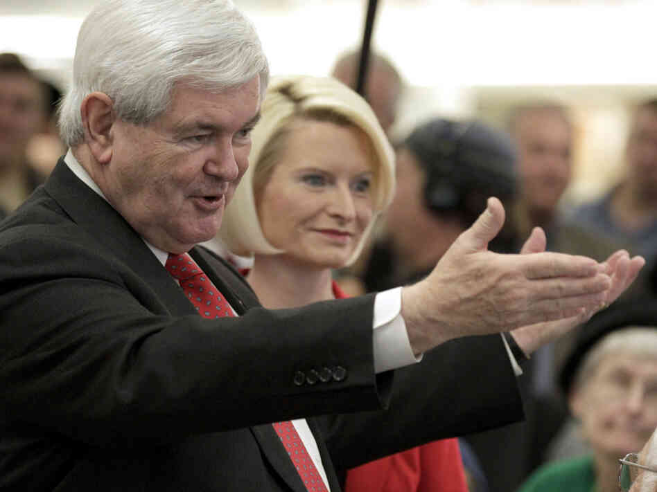 Republican presidential hopeful Newt Gingrich, with his wife, Callista, by his side, campaigns in Iowa on Tuesday. 