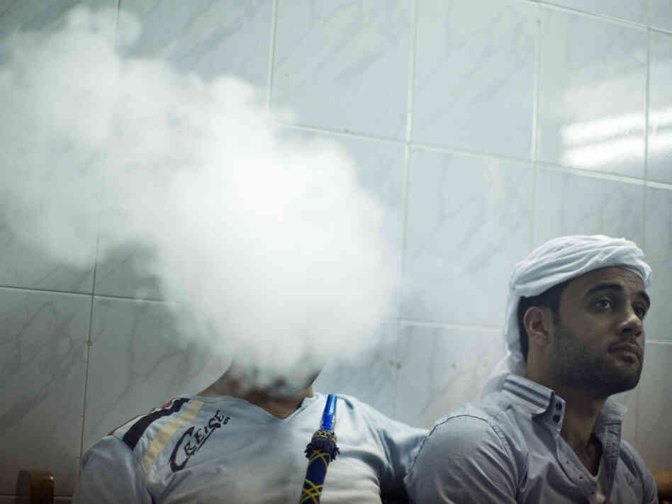 Photographer Moises Saman captured this shot of two activists in Hama, Syria. Saman and journalist Anthony Shadid entered the city for several days last July. The rest of Saman's images can be found here.