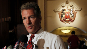 Sen. Scott Brown addresses reporters at a Boston hotel in August. Brown won the seat in a 2010 special election in large part by contrasting himself with the Kennedy dynasty.