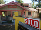 A "sold" sign outside a home in Pasadena, Calif., in September 2009. New data show fewer such sales that year. A "sold" sign outside a home in Pasadena, Calif., in September 2009. New data show fewer such sales that year.