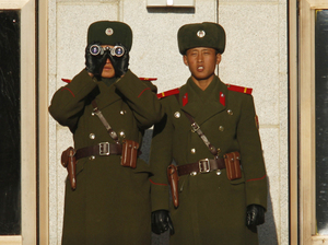 North Korean soldiers watch the South Korean side of the demilitarized zone on Thursday. North Korea has tightened security and put troops on alert since the announcement of Kim's death. North Korean soldiers watch the South Korean side of the demilitarized zone on Thursday. North Korea has tightened security and put troops on alert since the announcement of Kim's death.