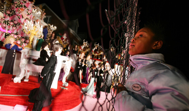 Onlookers gather in front of the Garabedian family home in the Bronx in this 2004 photo. The Garabedians have decorated their home for nearly four decades with lights and hundreds of animated figurines. Onlookers gather in front of the Garabedian family home in the Bronx in this 2004 photo. The Garabedians have decorated their home for nearly four decades with lights and hundreds of animated figurines.