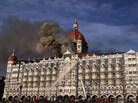 Indian firefighters attempt to put out a fire as smoke billows out of the historic Taj Mahal Hotel in Mumbai, which was stormed by armed gunmen in November 2008. Indian firefighters attempt to put out a fire as smoke billows out of the historic Taj Mahal Hotel in Mumbai, which was stormed by armed gunmen in November 2008.