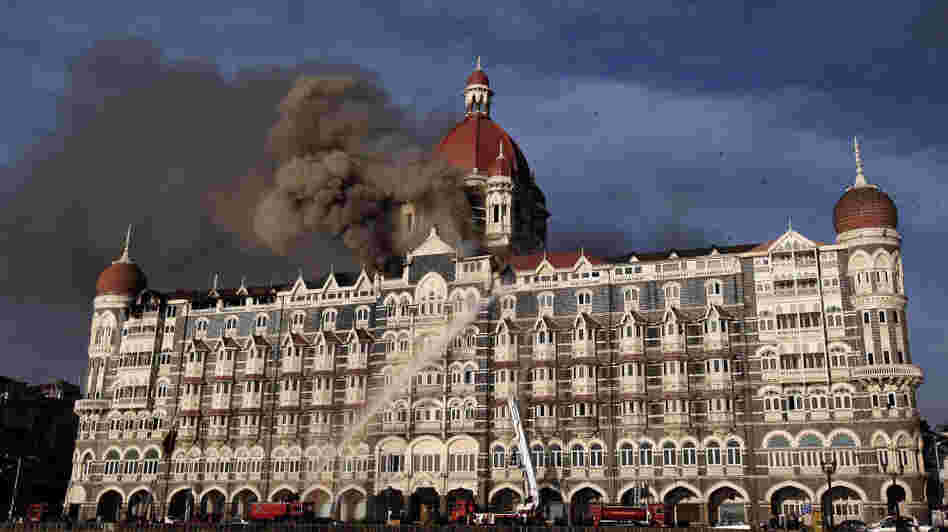 Indian firefighters attempt to put out a fire as smoke billows out of the historic Taj Mahal Hotel in Mumbai, which was stormed by armed gunmen in November 2008.