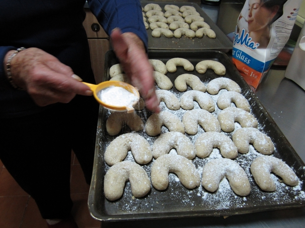  Dora Schmidt prepares a batch of Cuernito butter walnut cookies.