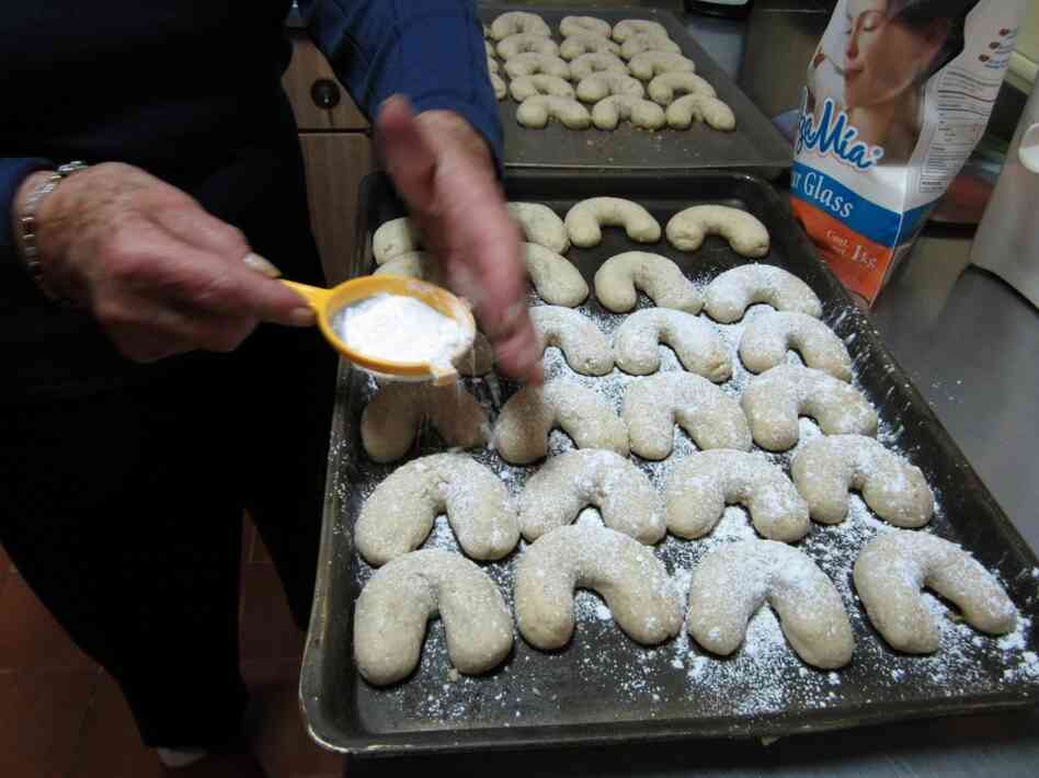  Dora Schmidt prepares a batch of Cuernito butter walnut cookies.