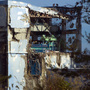 The crippled Fukushima Dai-ichi nuclear power station is seen through a bus window on Nov. 12. The four reactors that failed were stabilized this month.