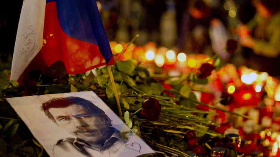A picture of former Czech President Vaclav Havel lay among candles and floral tributes as people gathered in Prague on Thursday to honor him.