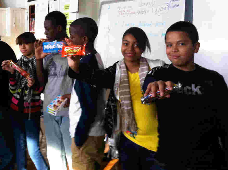 Students show off the results of their trades. Students show off the results of their trades.