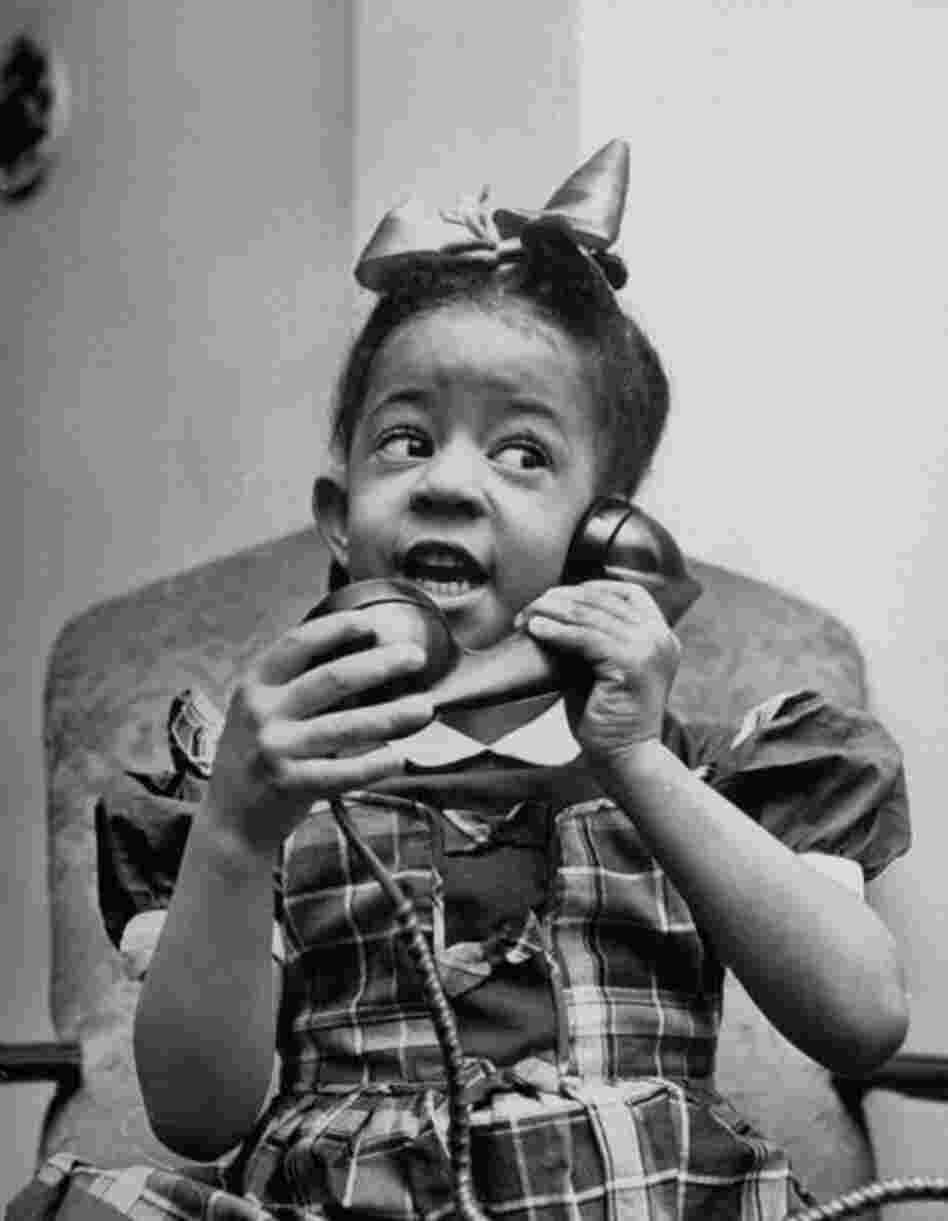 A confident Jo Ann Ward begins her conversation by saying,  "Hello, Santa Claus. How you feel?" The 3-year-old wants a doll and a boat.