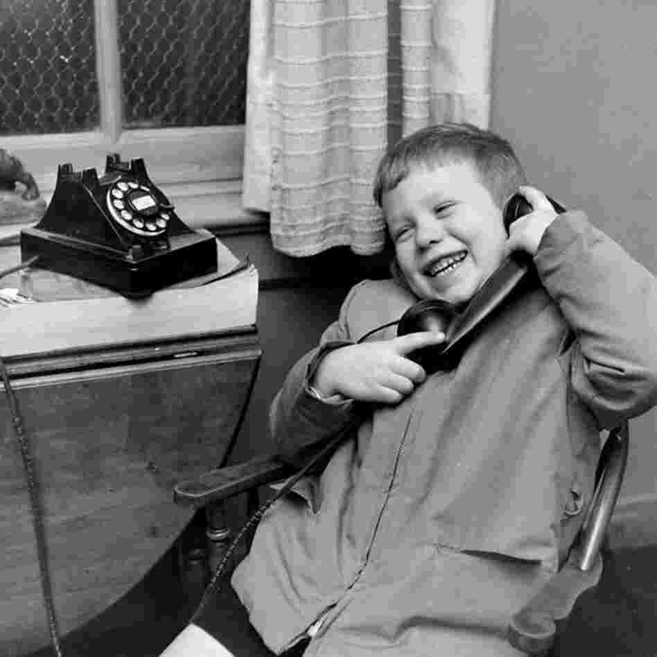 This young boy is all smiles with a perfect set of gleaming white teeth as he speaks with Santa.