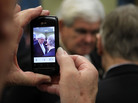 A supporter takes a photo with a cell phone as former Speaker of the House Newt Gingrich greets supporters Dec. 22 in Richmond. Gingrich said then that he would gather enough signatures to make the Virginia ballot, but over the weekend he failed to qualify. A supporter takes a photo with a cell phone as former Speaker of the House Newt Gingrich greets supporters Dec. 22 in Richmond. Gingrich said then that he would gather enough signatures to make the Virginia ballot, but over the weekend he failed to qualify.