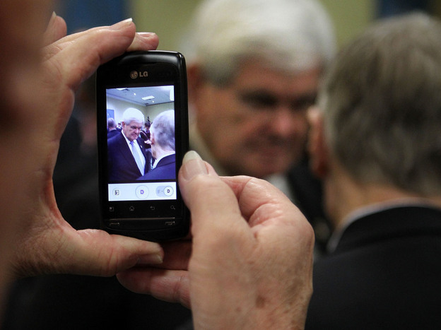 A supporter takes a photo with a cell phone as former Speaker of the House Newt Gingrich greets supporters Dec. 22 in Richmond. Gingrich said then that he would gather enough signatures to make the Virginia ballot, but over the weekend he failed to qualify.