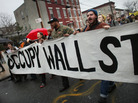 Occupy Wall Street protesters march through in an impoverished community in Brooklyn to protest home foreclosures. Many see the movement's dynamic strategies and aims as key to its success. Occupy Wall Street protesters march through in an impoverished community in Brooklyn to protest home foreclosures. Many see the movement's dynamic strategies and aims as key to its success.