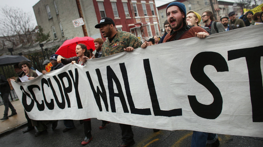  Occupy Wall Street protesters march through in an impoverished community in Brooklyn to protest home foreclosures. Many see the movement's dynamic strategies and aims as key to its success. 