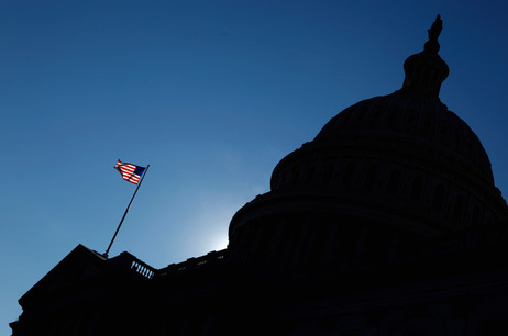The flag waves in front of the U.S. Capitol. The flag waves in front of the U.S. Capitol.