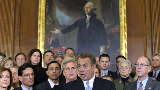 House Speaker John Boehner, surrounded by Republican House members, speaks during a news conference in Washington last week. The House initially rejected a plan to extend a tax cut for two months to buy time for talks on a full-year renewal. It later compromised — a rare event in 2011.