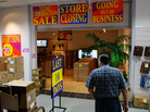 A shopper looks for bargains at an electronic store holding a going-out-of-business sale. A shopper looks for bargains at an electronic store holding a going-out-of-business sale.