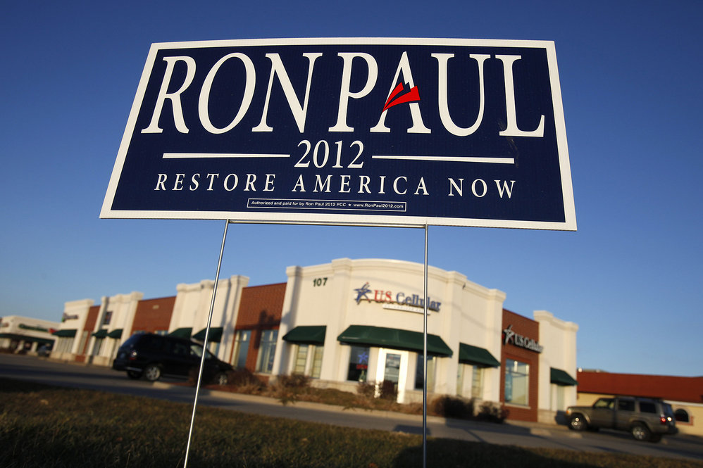 A campaign sign for Republican presidential candidate U.S. Rep. Ron Paul of Texas sits at an intersection in Ankeny, Iowa on Dec. 27. 