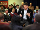 Texas Gov. Rick Perry speaks at a campaign event at Clark Electric Co-op on Dec. 27 in Osceola, Iowa. Perry's stance on immigration has troubled some Iowa voters. 