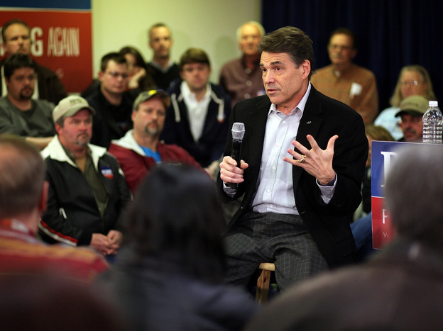 Texas Gov. Rick Perry speaks at a campaign event at Clark Electric Co-op on Dec. 27 in Osceola, Iowa. Perry's stance on immigration has troubled some Iowa voters. 