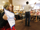A young supporter backs former Massachusetts Gov. Mitt Romney as he speaks on Wednesday at Homer's Deli and Bakery in Clinton, Iowa. A young supporter backs former Massachusetts Gov. Mitt Romney as he speaks on Wednesday at Homer's Deli and Bakery in Clinton, Iowa.