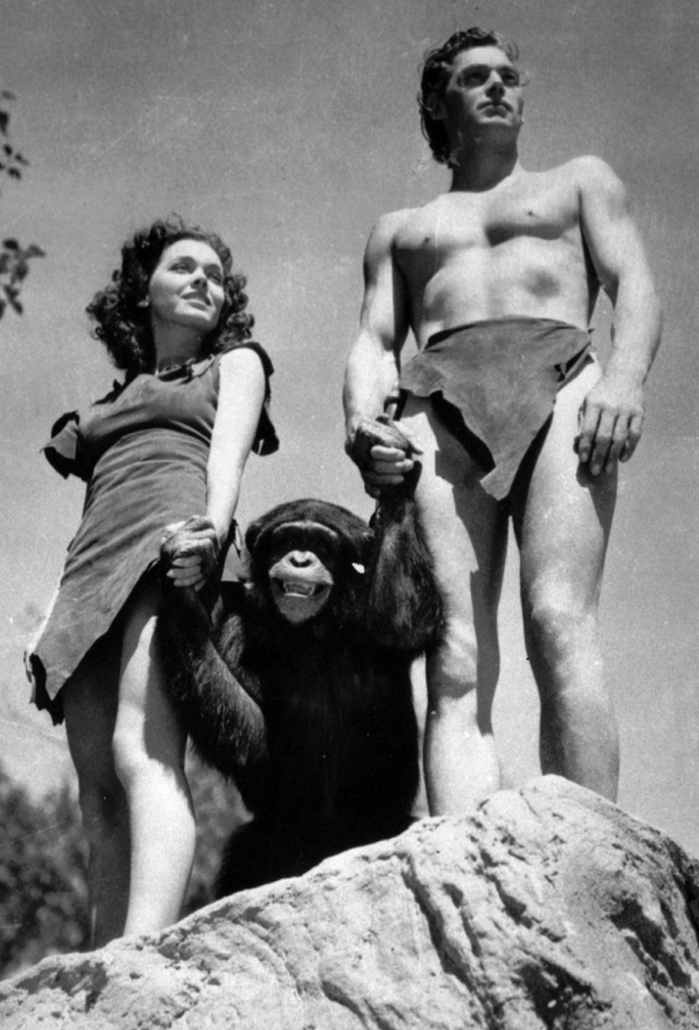1932 scene from Tarzan the Ape Man: Johnny Weissmuller, right, as Tarzan, Maureen O'Sullivan as Jane, and one of the chimps who played Cheetah.