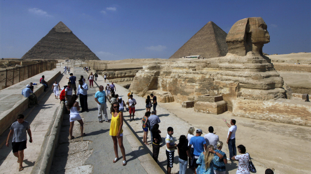 Tourists visit the Sphinx and the Pyramids of Giza near Cairo. Tourist numbers have plummeted this year with the political turmoil in Egypt. Now, some Islamist politicians are proposing rules that could discourage visitors.
