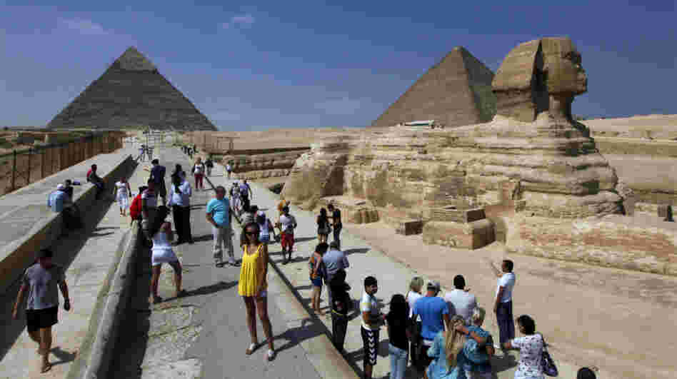 Tourists visit the Sphinx and the Pyramids of Giza near Cairo. Tourist numbers have plummeted this year with the political turmoil in Egypt. Now, some Islamist politicians are proposing rules that could discourage visitors.