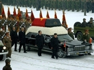 This photo provided by Korean Central News Agency (KCNA) shows Kim Jong Un, center, with his hand on the limousine bearing his father Kim Jong Il's body during the funeral procession in Pyongyang. This photo provided by Korean Central News Agency (KCNA) shows Kim Jong Un, center, with his hand on the limousine bearing his father Kim Jong Il's body during the funeral procession in Pyongyang.
