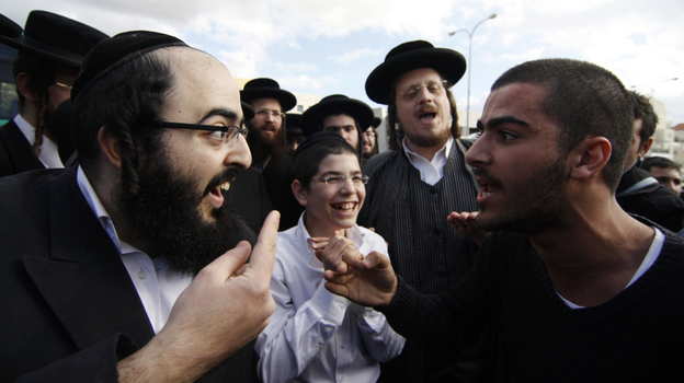 An ultra-Orthodox Jewish man (l) and a secular man argue during a protest against the strict religious codes favored by the ultra-Orthodox in the Israeli city of Beit Shemesh. An ultra-Orthodox Jewish man (l) and a secular man argue during a protest against the strict religious codes favored by the ultra-Orthodox in the Israeli city of Beit Shemesh.