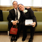 Same-sex couple Joseph and Jim pose for a photo as they wait to be officially married at the Manhattan City Clerk's Office on July 24, 2011, the first day gay couples were allowed to legally marry in New York. 
