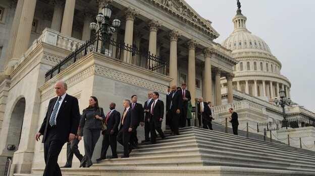 Lawmakers walk down the House steps to leave for the Christmas holiday. Lawmakers walk down the House steps to leave for the Christmas holiday.