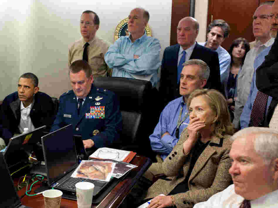 President Obama, Vice President Joe Biden and members of his National Security team receive an update on the mission against Osama bin Laden in the Situation Room of the White House. A classified document seen in this photograph has been obscured.