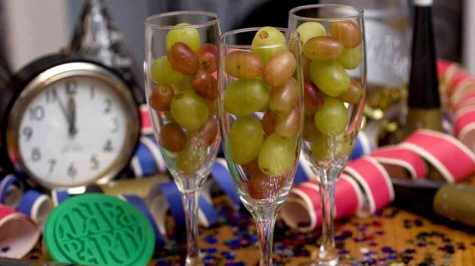 Champagne flutes filled with grapes. Champagne flutes filled with grapes.