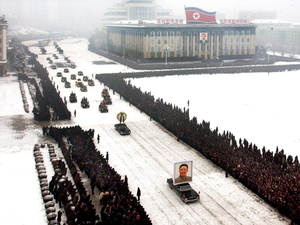 This image, released by the North Korean Central News Agency, was taken within seconds of the one above. An analysis shows that it was digitally altered, removing the cluster of men on the left edge and enhancing the perfect line of mourners. This image, released by the North Korean Central News Agency, was taken within seconds of the one above. An analysis shows that it was digitally altered, removing the cluster of men on the left edge and enhancing the perfect line of mourners.