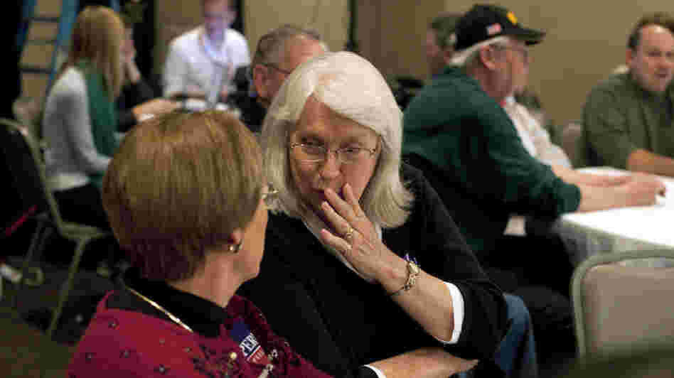 Potential caucus-goers Janet Erwin, center, and Celma Higgins attend a campaign event for Texas Gov. Rick Perry in Indianola, Iowa.