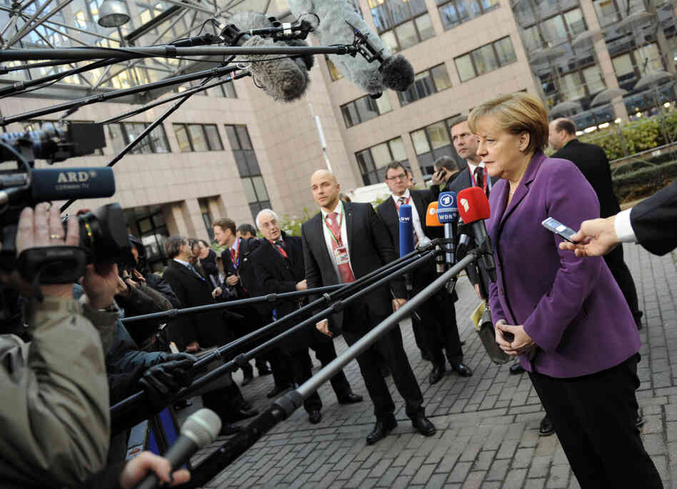 German Chancellor Angela Merkel addresses journalists at EU headquarters in Brussels in December. It's possible that European leaders will come up with ways to manage the region's debt crisis in the new year, but the worst case scenarios are dire. German Chancellor Angela Merkel addresses journalists at EU headquarters in Brussels in December. It's possible that European leaders will come up with ways to manage the region's debt crisis in the new year, but the worst case scenarios are dire.