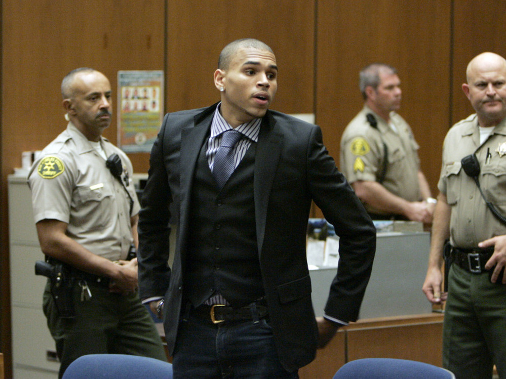 Chris Brown prepares to leave court after a hearing in Los Angeles in November 2009, to offer a judge his first progress report since being sentenced for beating ex-girlfriend Rihanna earlier that year. 