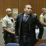Chris Brown prepares to leave court after a hearing in Los Angeles in November 2009, to offer a judge his first progress report since being sentenced for beating ex-girlfriend Rihanna earlier that year. 