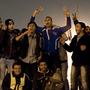 Egyptian anti-government protesters celebrate at Tahrir Square in Cairo on February 11, 2011 after President Hosni Mubarak stepped down after three decades of autocratic rule and handed power to a junta of senior military commanders.