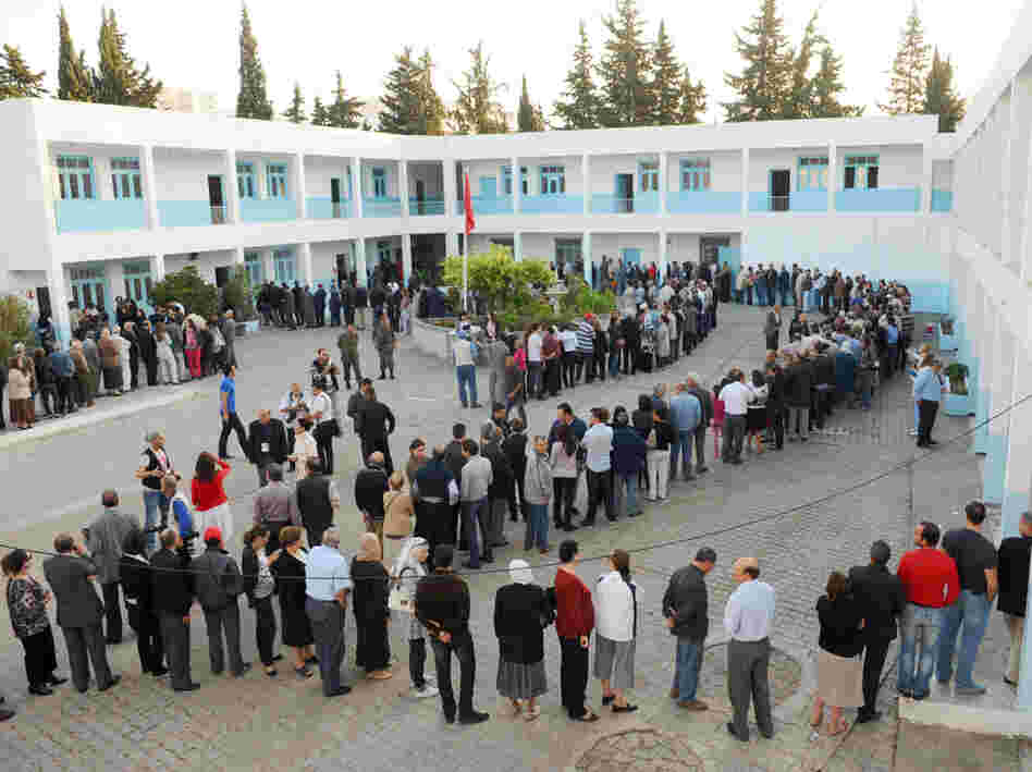 Tunisians have elected an assembly to write a new constitution. Voters are shown here on Oct. 23, 2011, outside a polling station in the capital Tunis. 
